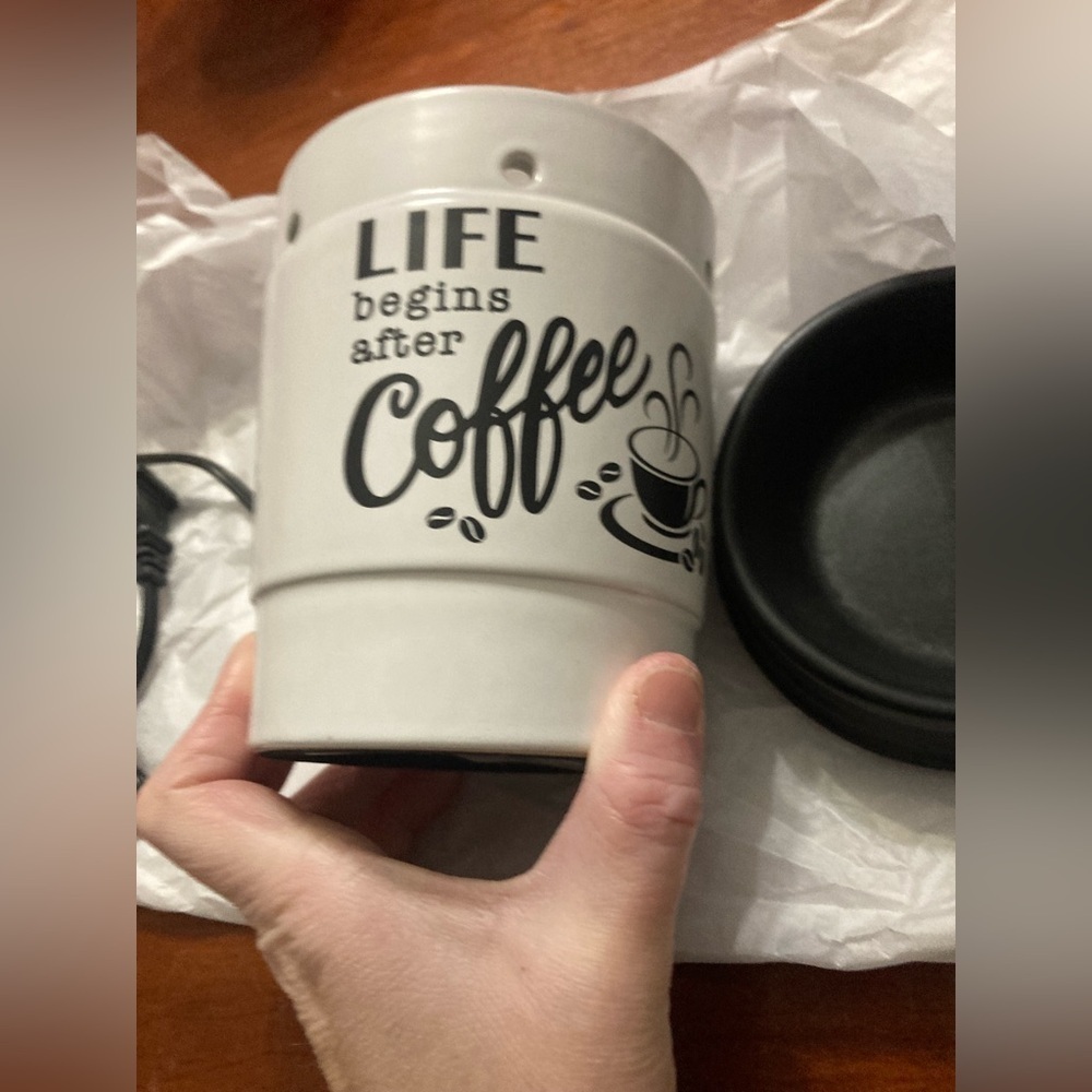 White wax warmer.plug in. Has the saying Life begins after coffee.Brand new āļø